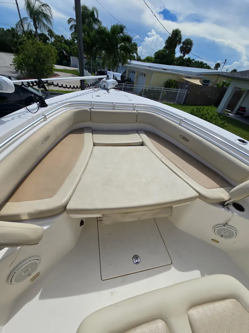Slide: The Image of 2015 Cobia 296 Center Console boat with spacious seating and storage. - 46