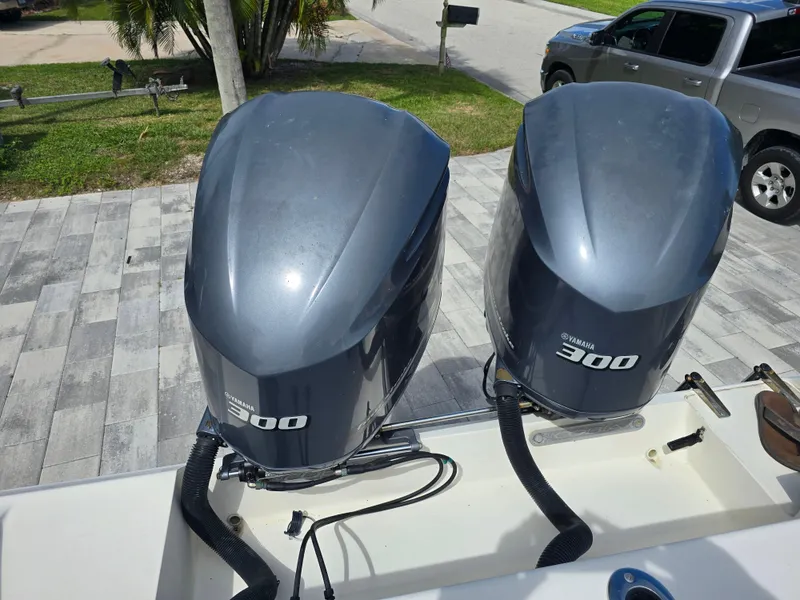 Slide: The Image of Twin Yamaha 300 engines on a 2015 Cobia 296 Center Console boat. - 47