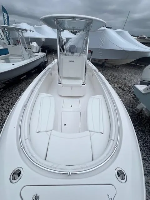 Slide: The Image of 2024 Contender 24 Sport boat with sleek design and spacious deck. - 4