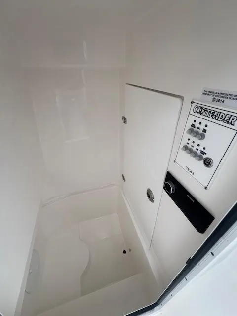 Slide: The Image of 2024 Contender 24 Sport boat interior with control panel. - 5