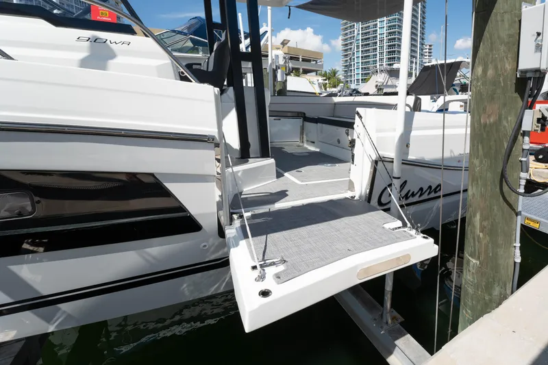 Slide: The Image of 2024 Jeanneau Leader 9.0WA S2 yacht docked with extended swim platform. - 14
