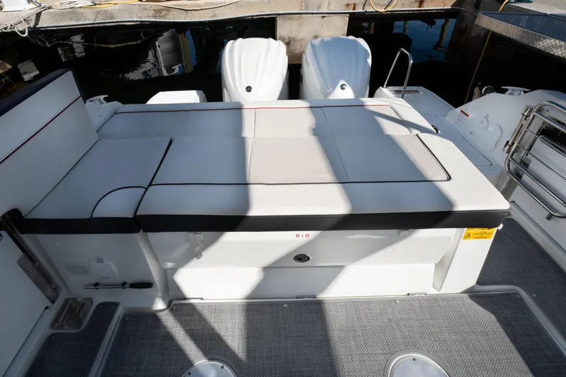 Slide: The Image of 2024 Jeanneau Leader 9.0WA S2 boat with twin engines and spacious deck seating. - 15