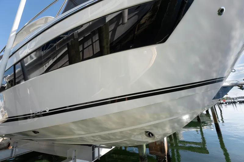 Slide: The Image of 2024 Jeanneau Leader 9.0WA S2 boat hull, docked in marina. - 17