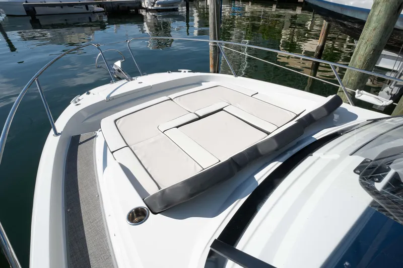 Slide: The Image of 2024 Jeanneau Leader 9.0WA S2 boat with spacious sunbathing deck at marina. - 19