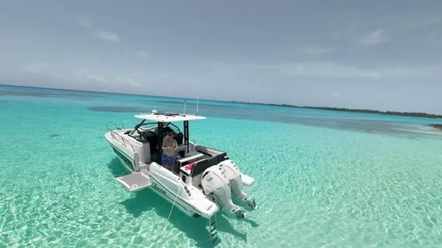 Slide: The Image of 2024 Jeanneau Leader 9.0WA S2 in crystal-clear turquoise waters. - 2
