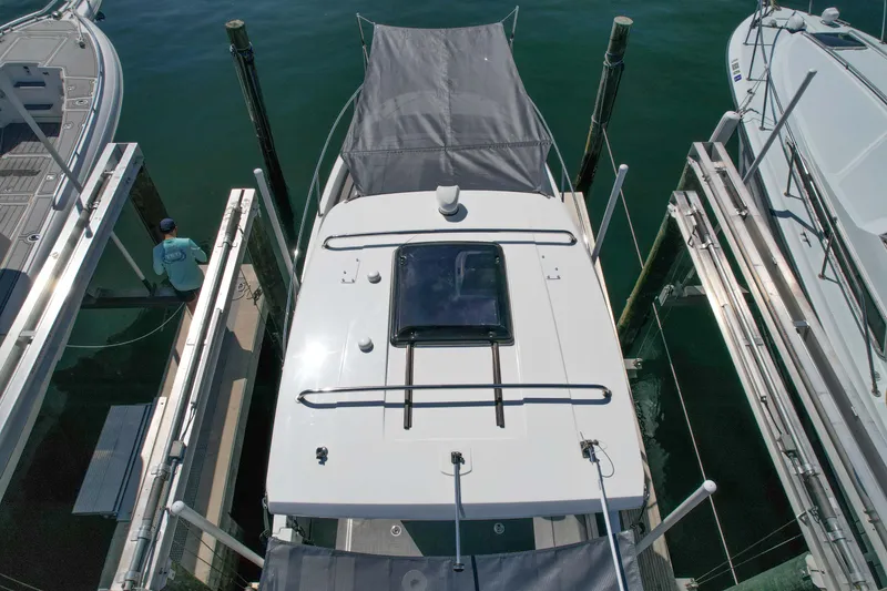 Slide: The Image of 2024 Jeanneau Leader 9.0WA S2 docked at marina, aerial view. - 20