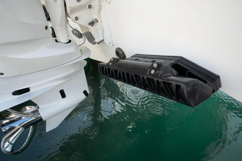Slide: The Image of 2024 Jeanneau Leader 9.0WA S2 boat engine and transducer in water. - 25