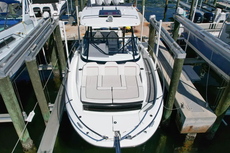 Slide: The Image of 2024 Jeanneau Leader 9.0WA S2 boat docked at marina, aerial view. - 3
