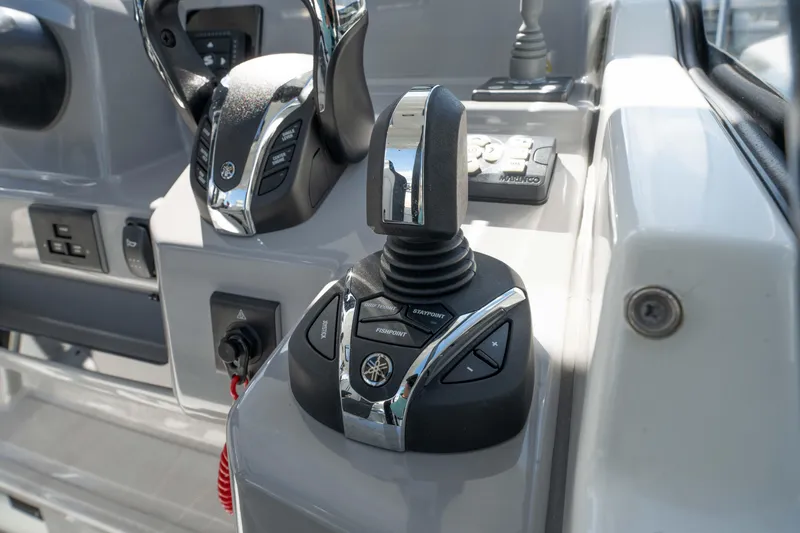 Slide: The Image of 2024 Jeanneau Leader 9.0WA S2 boat controls with joystick and throttle. - 32