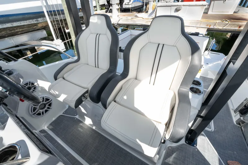 Slide: The Image of 2024 Jeanneau Leader 9.0WA S2 boat seats, sleek design, modern upholstery, docked at marina. - 34