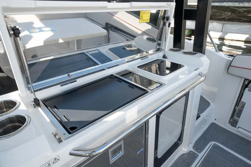 Slide: The Image of 2024 Jeanneau Leader 9.0WA S2 boat interior with sleek kitchen area. - 39