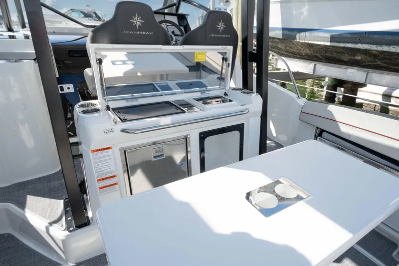 Slide: The Image of 2024 Jeanneau Leader 9.0WA S2 boat interior with seating and table setup. - 41