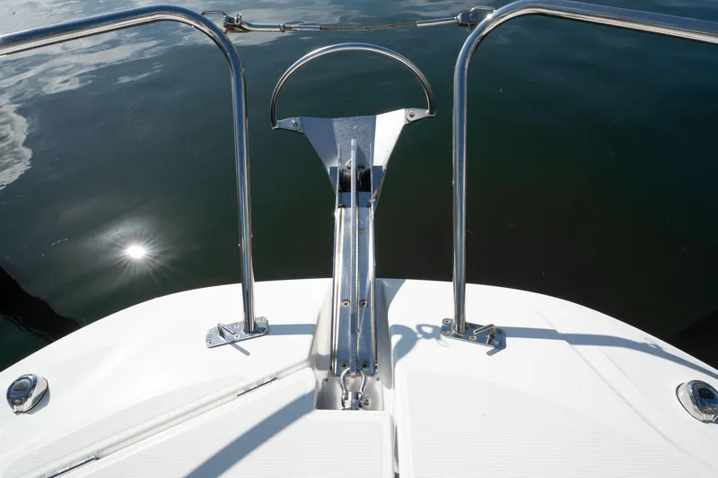 Slide: The Image of 2024 Jeanneau Leader 9.0WA S2 bow with stainless steel railings on calm water. - 45