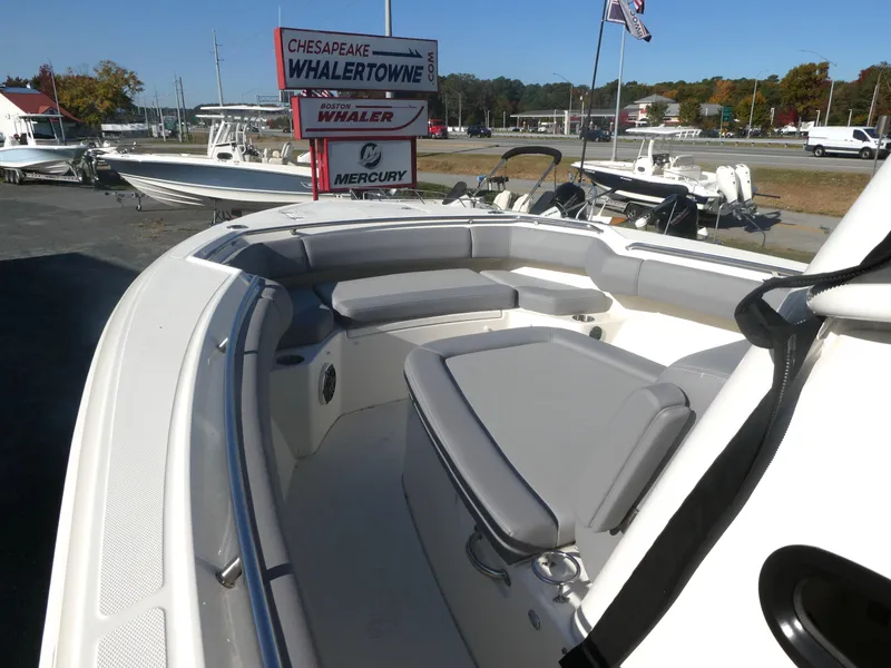 Slide: The Image of 2024 Boston Whaler 280 Outrage boat interior with seating, at Whalertowne dealership. - 12