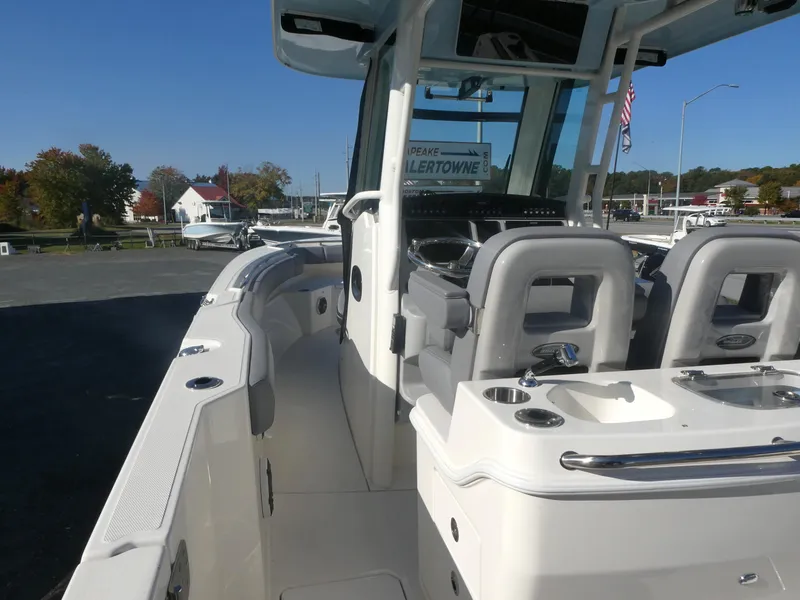 Slide: The Image of 2024 Boston Whaler 280 Outrage boat interior with seating and console. - 6