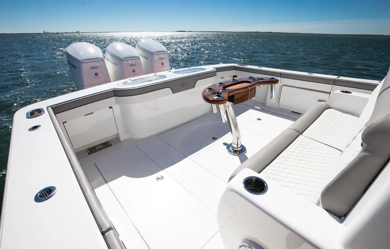 Slide: The Image of 2022 Valhalla Boatworks 46 Center Console on open water, featuring spacious deck and triple engines. - 10