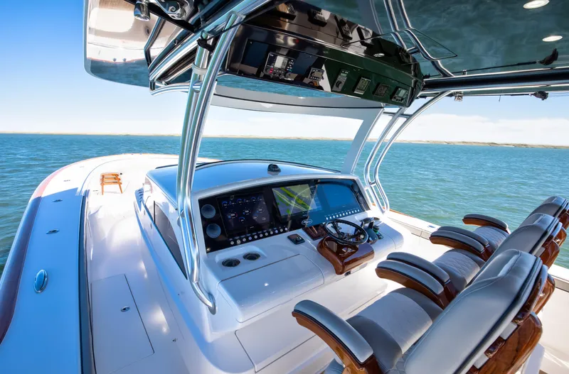Slide: The Image of 2022 Valhalla Boatworks 46 Center Console on open water, featuring advanced navigation controls. - 13
