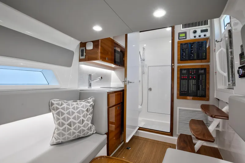 Slide: The Image of Interior of 2022 Valhalla Boatworks 46 Center Console, featuring modern seating and control panels. - 19
