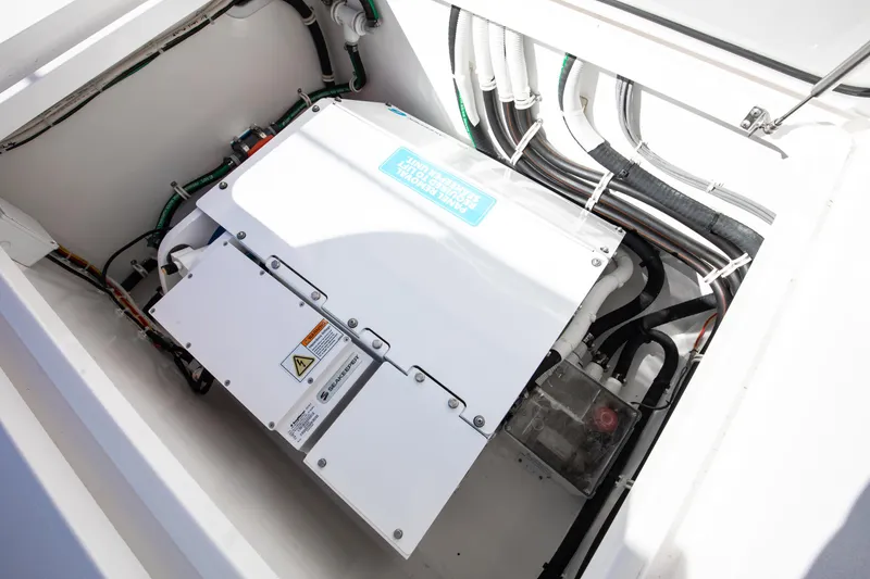 Slide: The Image of Engine compartment of 2022 Valhalla Boatworks 46 Center Console, showcasing wiring and components. - 22