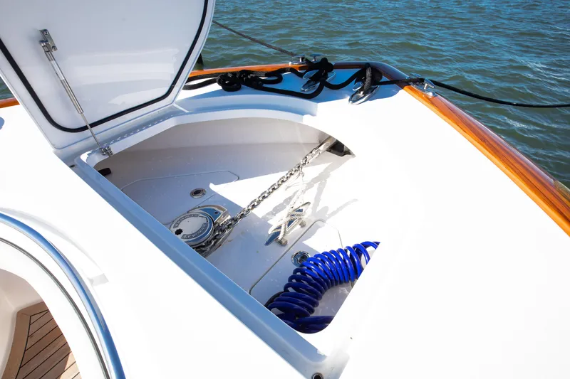 Slide: The Image of 2022 Valhalla Boatworks 46 Center Console anchor compartment with chain and hose. - 9