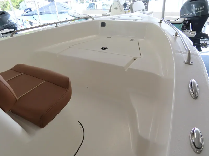 Slide: The Image of 2025 Key West 179 FS boat interior with seating and storage compartments. - 13
