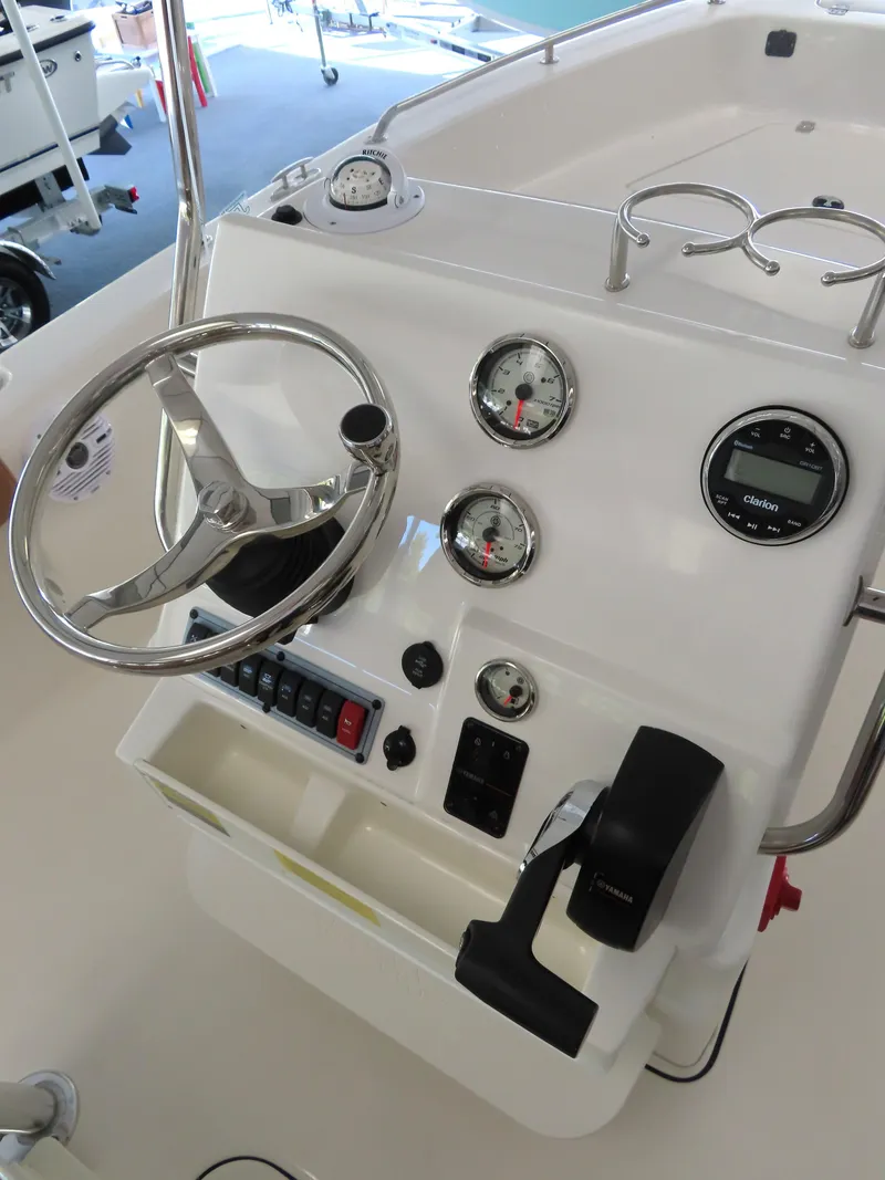 Slide: The Image of 2025 Key West 179 FS boat console with steering wheel and gauges. - 20