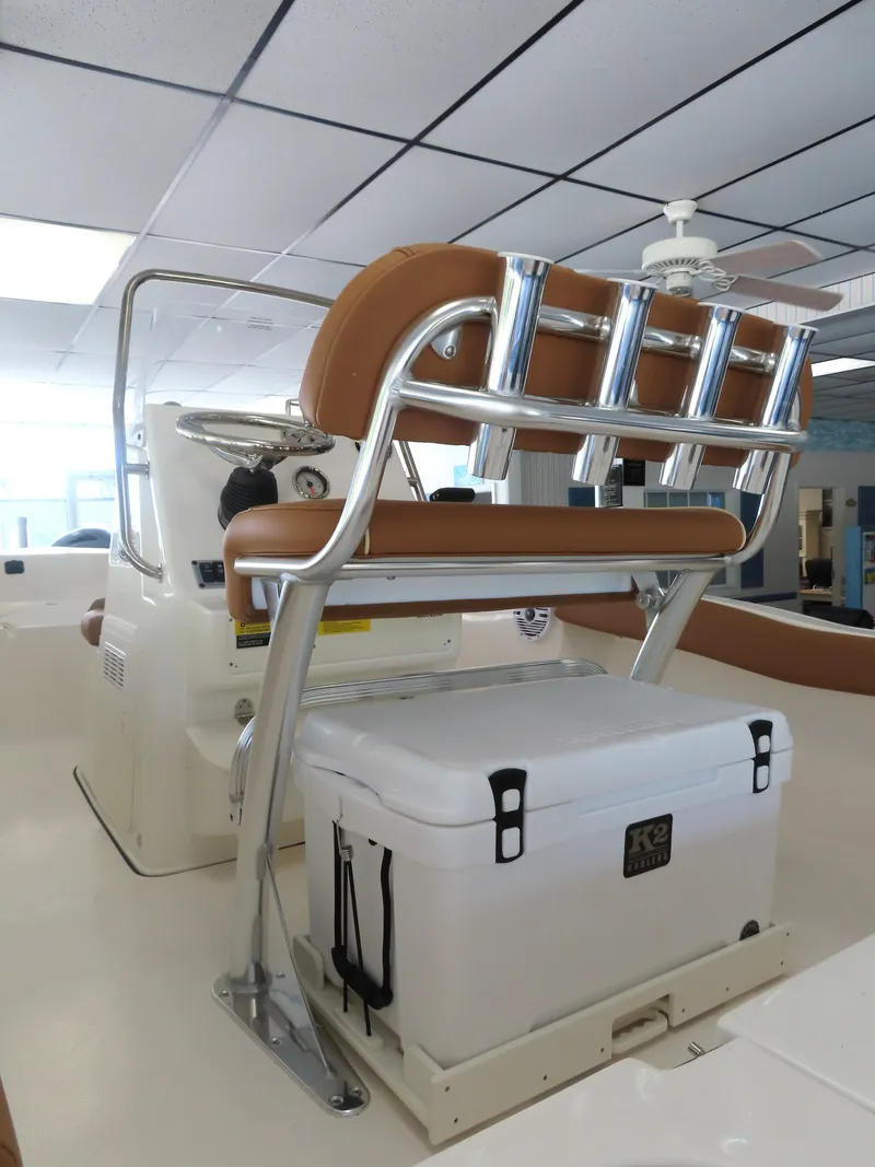 Slide: The Image of 2025 Key West 179 FS boat interior with cushioned seating and storage. - 23