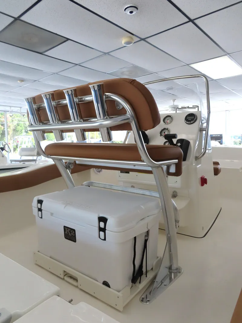 Slide: The Image of 2025 Key West 179 FS boat interior with seating and cooler. - 24
