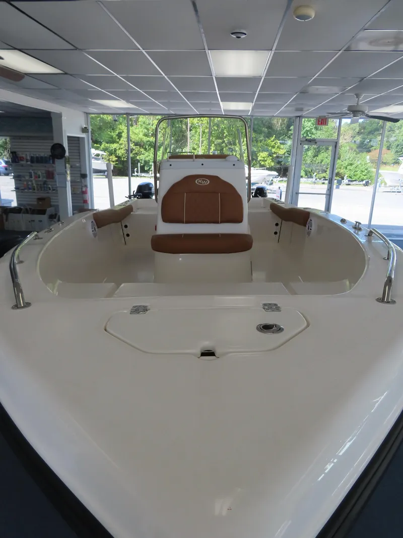Slide: The Image of 2025 Key West 179 FS boat interior in showroom, featuring sleek design and comfortable seating. - 7