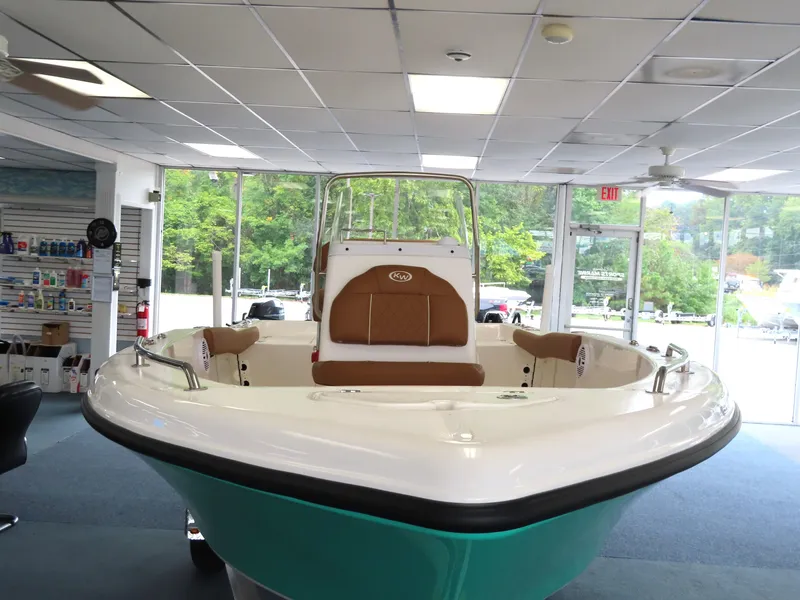 Slide: The Image of 2025 Key West 179 FS boat displayed indoors, featuring sleek design and comfortable seating. - 8