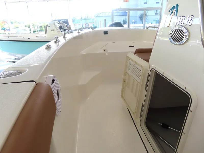 Slide: The Image of 2025 Key West 179 FS boat interior with seating and storage compartment. - 9