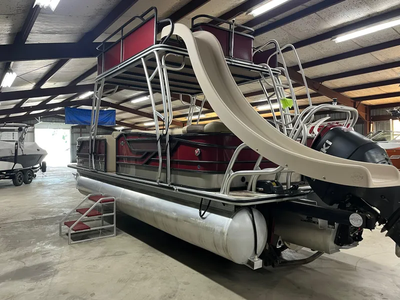 Slide: The Image of 2016 Crest 250 L pontoon boat with slide in indoor storage. - 3