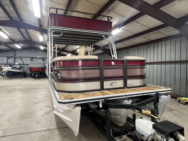 Slide: The Image of 2016 Crest 250 L pontoon boat in a storage facility. - 6