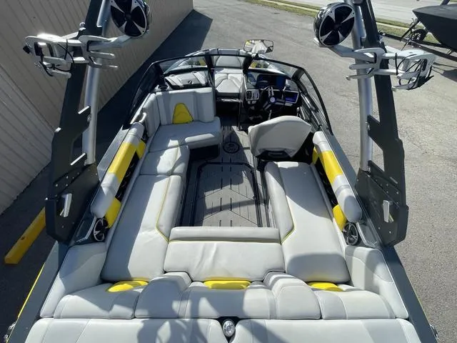 Slide: The Image of 2017 Malibu 21 VLX boat interior with spacious seating and modern design. - 8