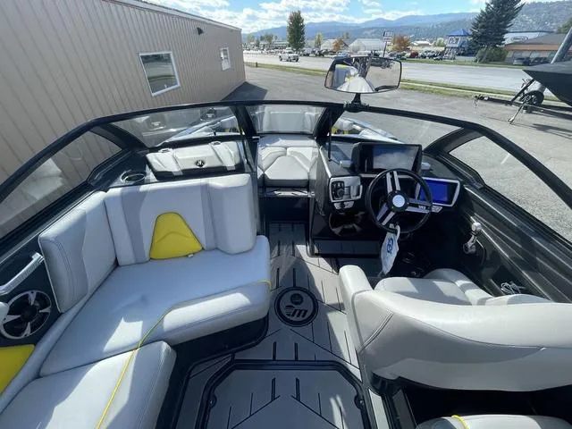 Slide: The Image of 2017 Malibu 21 VLX boat interior with modern dashboard and seating. - 9