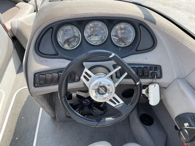 Slide: The Image of 2005 Malibu Sunsetter XTi boat dashboard with steering wheel and gauges. - 10