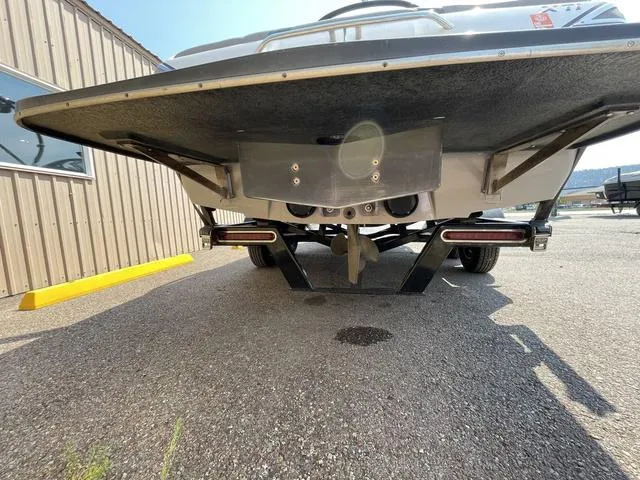 Slide: The Image of 2005 Malibu Sunsetter XTi boat underside view in a parking lot. - 4