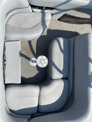 Slide: The Image of 2005 Malibu Sunsetter XTi boat interior with gray seating and floor details. - 8