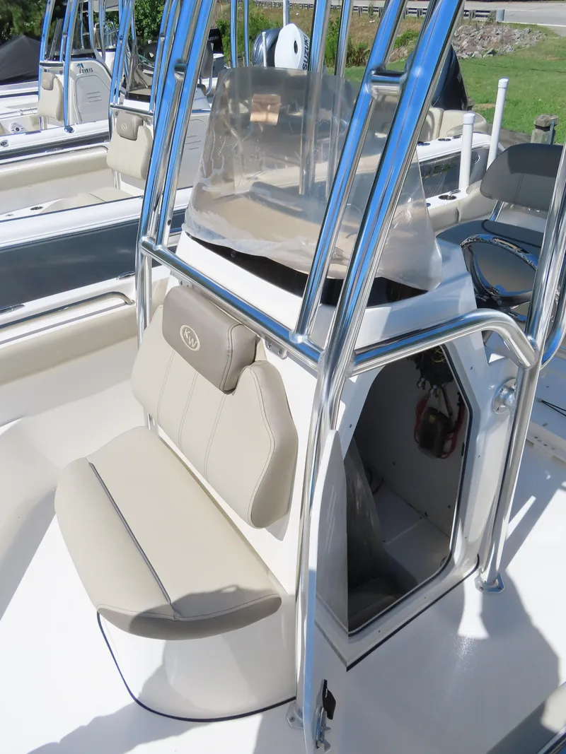 Slide: The Image of 2024 Key West 203 FS boat interior with seating and console. - 11