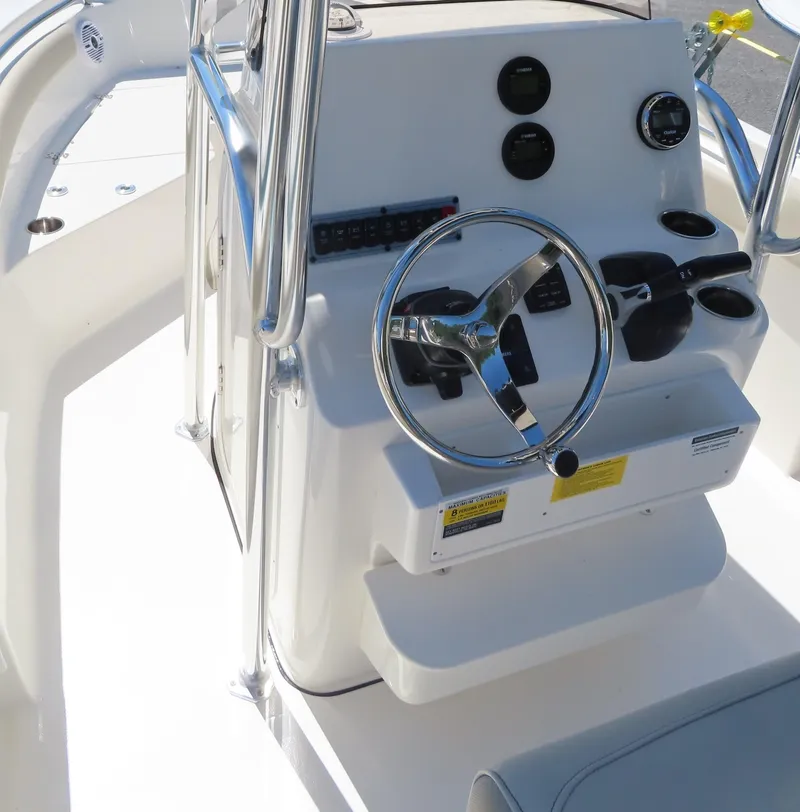 Slide: The Image of 2024 Key West 203 FS boat console with steering wheel and gauges. - 12
