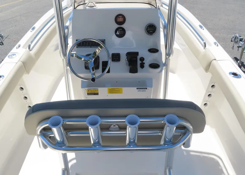 Slide: The Image of 2024 Key West 203 FS boat console with steering wheel and rod holders. - 13