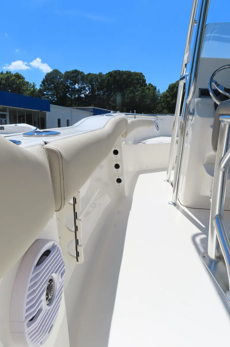 Slide: The Image of 2024 Key West 203 FS boat interior with speaker, sunny day. - 14