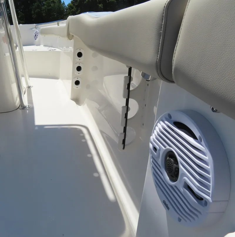 Slide: The Image of 2024 Key West 203 FS boat interior with speaker and seating. - 15