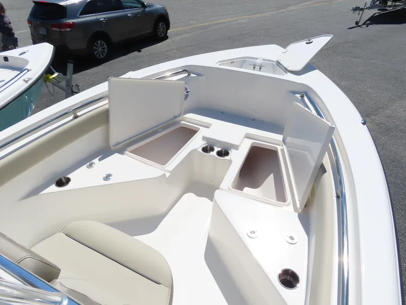 Slide: The Image of 2024 Key West 203 FS boat interior with open storage compartments. - 18