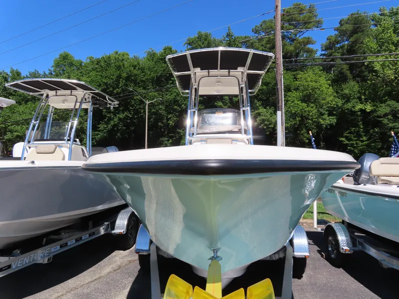 Slide: The Image of 2024 Key West 203 FS boat on trailer, parked outdoors. - 2