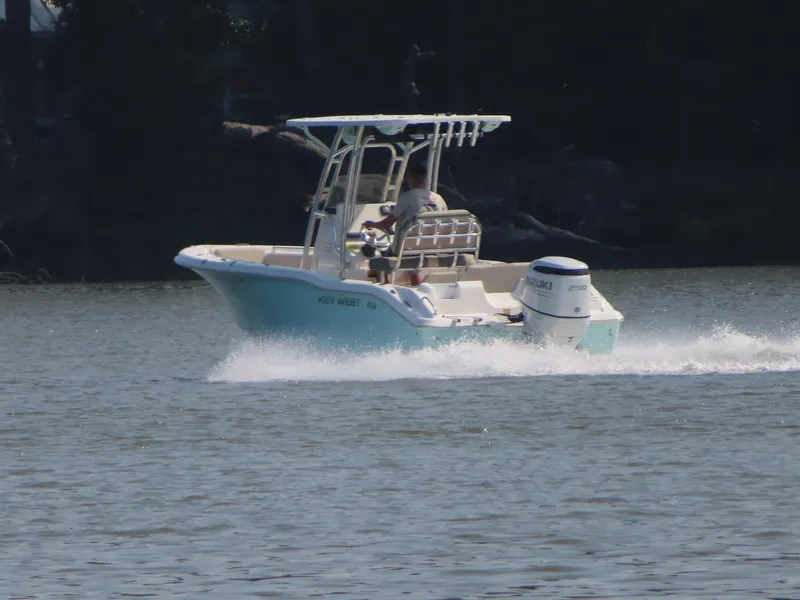 Slide: The Image of 2024 Key West 203 FS boat cruising on a calm lake. - 22