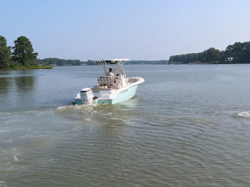 Slide: The Image of 2024 Key West 203 FS boat cruising on a calm lake. - 23