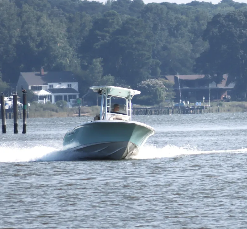 Slide: The Image of 2024 Key West 203 FS boat cruising on a scenic river. - 24