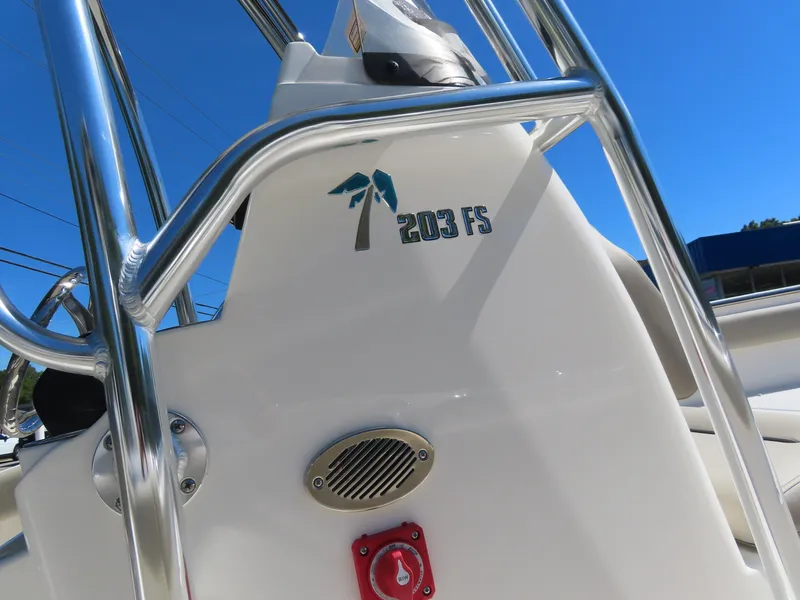 Slide: The Image of 2024 Key West 203 FS boat console with logo and stainless steel railing. - 3