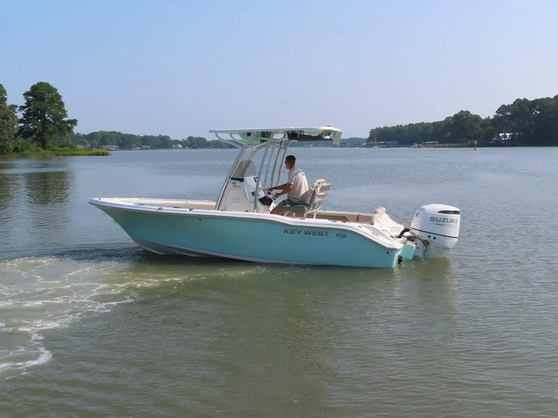 Slide: The Image of 2024 Key West 203 FS boat cruising on a calm lake. - 34